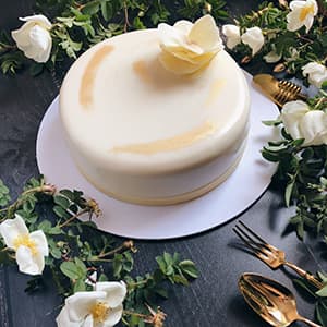 Mousse cake with chocolate edible flower covered with gold