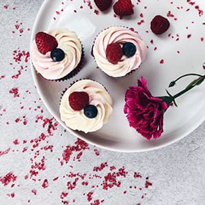 Red Velvet Raspberry cupcake with berries