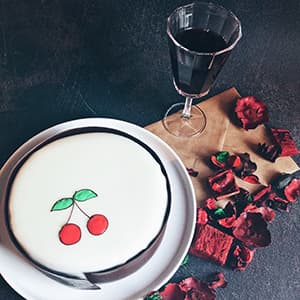 Edible cherries drawing on a cake